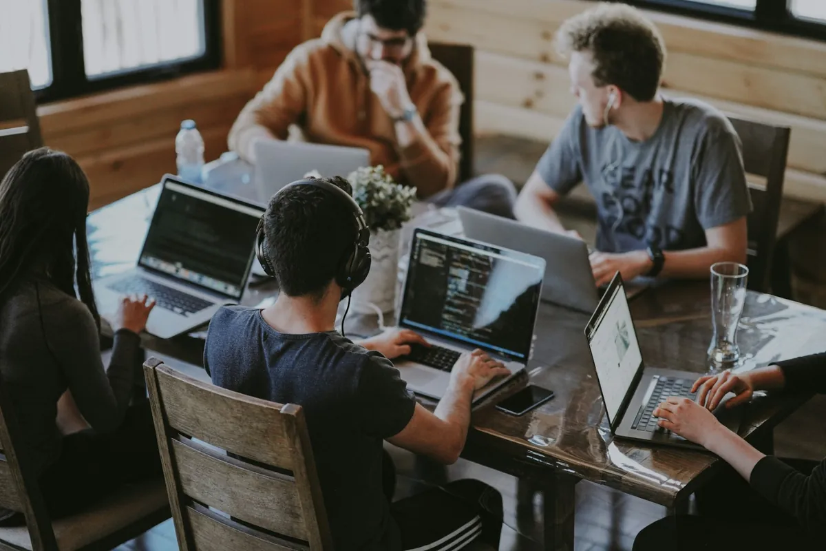 Suviara Forge team planning a software project on laptops